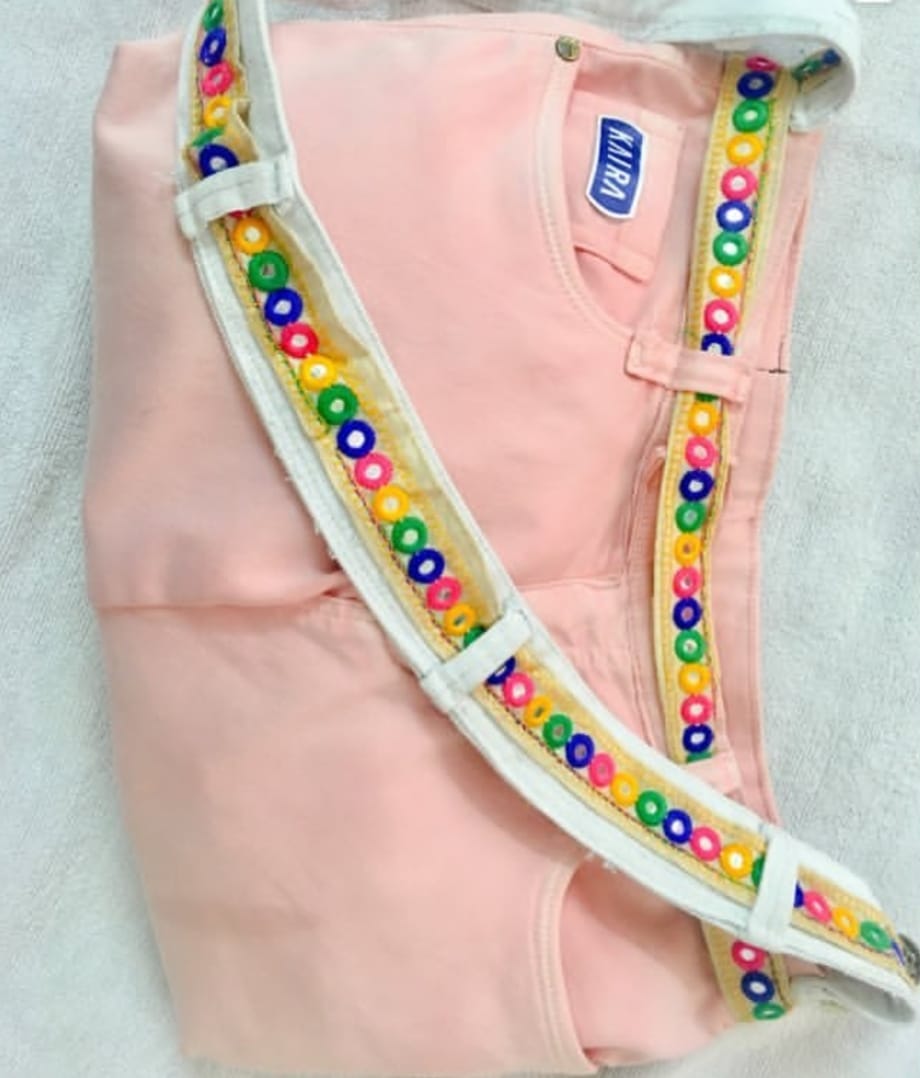 Customer's pink denim bag with a colourful beaded KAIRA strap