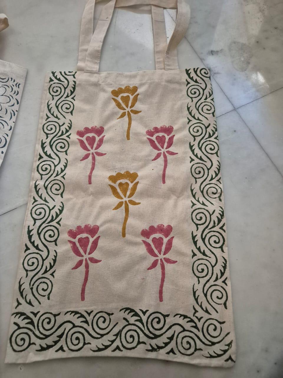 Cotton tote bag with hand block-printed roses and a green vine border