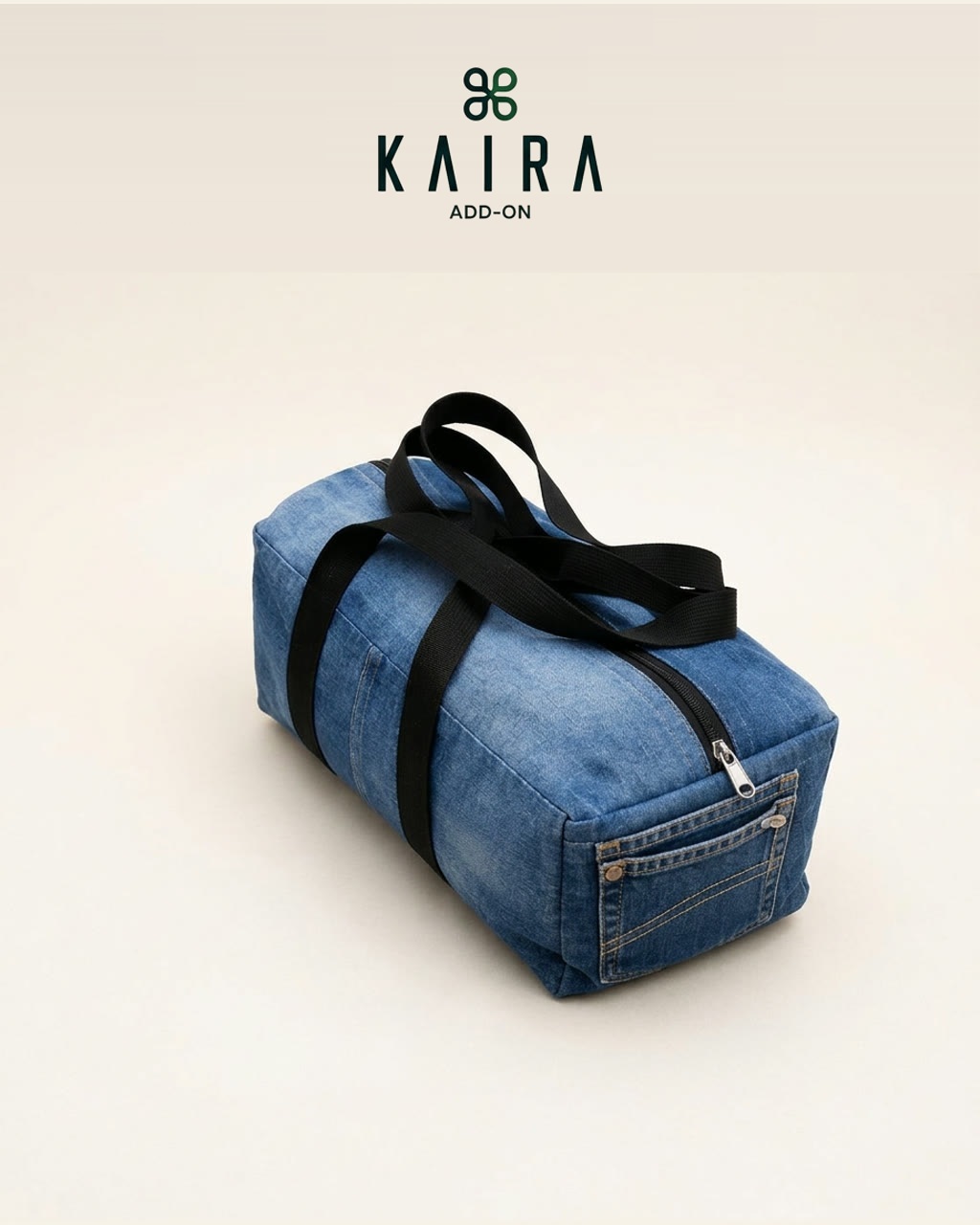 KAIRA.ADDON Denim Duffle Bag in washed upcycled denim with webbing handles, a full-length zip and an outer jeans pocket
